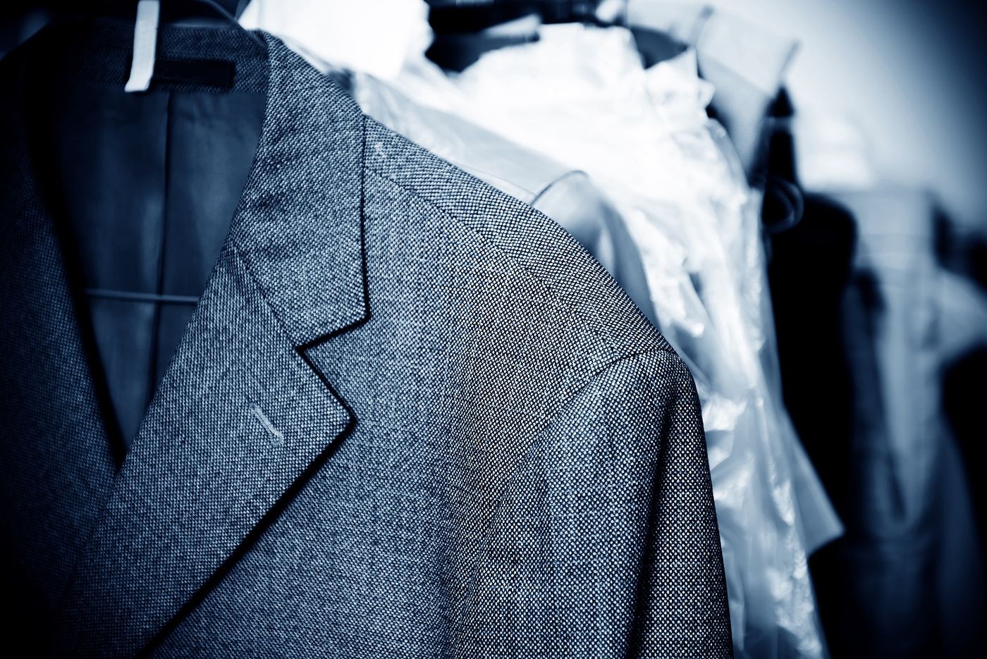 Dry cleaning garments on a rack at AlterCleaners