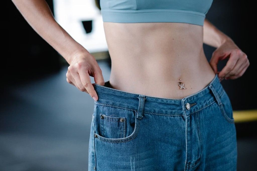 Jeans with a loose waist that need a tailor to take them in